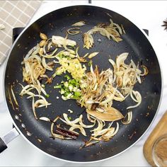 the food is being prepared in the pan on the stove top, and ready to be cooked