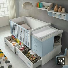 a baby's room with a crib, dresser and changing table in it