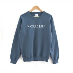 FREE SHIPPING (US Only) Southern Mama Sweatshirt | Mama Sweatshirt - Mama Shirt - Shirt for Mom - Mother's Day Shirt This adult sweatshirt is super soft; SIZE UP for a slouchy/oversized look. This sweat will quickly become your favorite. Perfect for joggers, the gym and really anything! --------------------------------------------- Southern Mama Sweatshirt * Hand Printed in White Ink * All Colors are Cotton/Poly Blends * Hand Printed in the USA --------------------------------------------- * ADU Casual Cotton Sweatshirt With Name Print, Cotton Sweatshirt With Name Print, Casual Blue Sweatshirt With Name Print, Mama Bear Sweatshirt, Country Girl Shirts, Mama Bear Shirt, Funny Coffee Shirts, Cat Mom Shirts, Coffee Sweatshirt