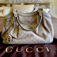 Authentic Gucci Sukey Medium Tote Bag In A Beautiful Very Light Taupe Color. Brand New Never Been Used. All Leather Exterior With Neutral Color Hardware That Can Go With Either Gold Or Silver Accessories. Snap Closure With One Zip Pocket Inside. Two Handles With 7” Drop And A Gucci Charm. This Cream/ Taupe Color Makes The Bag So Versatile In Any Season. The Gucci Dust Bag And Booklets Will Be Included. Made In Italy. Designer Shoulder Bag With Horsebit Detail For Daily Use, Beige Travel Bag With Horsebit Detail, Gucci Travel Bag With Horsebit Detail, Luxury Bags With Horsebit Detail, Elegant Gucci Shoulder Bag With Top Carry Handle, Elegant Gucci Bag With Top Carry Handle, Rectangular Shopping Bag With Horsebit Detail, Rectangular Shopping Bags With Horsebit Detail, High-end Leather Bag With Horsebit Detail