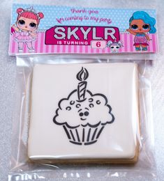 there is a cookie with a cupcake on it in the package for someone's birthday