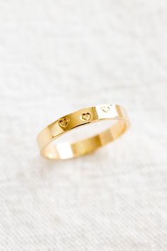 14k gold filled hand stamped triple heart band ring Please note: this ring is handmade and hand stamped so it may not be perfect and they will not look exactly like the photos! Please note: there may be slight color variations or a seam where the joints of the ring has been soldered. Since this piece is handmade, keep in mind that solder marks are visible and is totally normal! Sold individually Stamped Ring, Triple Heart, Heart Band, White Opal Ring, Stamped Rings, Jewelry Lockets, Jewelry Workshop, Anklet Bracelet, Jewelry Repair