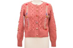 This lovely hand-embroidered cardigan will brighten up any chilly day. The Adeline Sweater combines bobble detailing, intricate floral hand-embroidery and delicate mohair embroidered buttons which add charm to this 1930s inspired sweater. 100% super fine wool. Winter Pink Cardigan With Floral Embroidery, Fitted Bohemian Cardigan With Floral Embroidery, Pink Floral Embroidered Winter Cardigan, Pink Floral Embroidery Cardigan For Winter, Pink Embroidered Fitted Cardigan, Fitted Embroidered Pink Cardigan, Fitted Pink Embroidered Cardigan, Embroidered Buttons, Hand Accessories