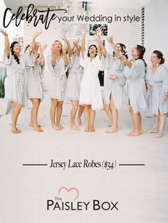 a group of women standing in front of a white wall