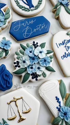 decorated cookies with blue and white flowers on them, including one that says i miss boston