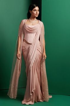 Pink pastel sheer cape with bead embellished stripe patterns. Comes with a solid pre-draped saree and a quilted panelled longline corset. - Aza Fashions Sheer Cape, Beaded Cape, Draped Saree, Drape Saree, Beaded Neckline, Cape Sleeves, Pink Pastel, Set For Women, Long A Line