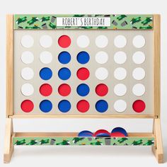 the wooden family board game with red, white and blue circles on it's sides