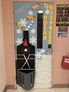 a classroom door decorated to look like a polar express train with snow on the ground