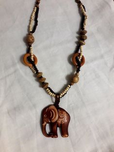 Large Wooden Elephant Pendant Brown Wood Boho Necklace Indian - Etsy Bohemian Wood Beaded Jewelry, Adjustable Bohemian Wood Jewelry, Bohemian Wood Beaded Necklaces, Bohemian Wooden Beaded Necklace, Traditional Handmade Wooden Jewelry, Brown Wooden Beads Pendant Necklace, Bohemian Brown Wooden Beaded Necklaces, Handmade Brown Hippie Necklace, Handmade Brown Hippie Necklaces