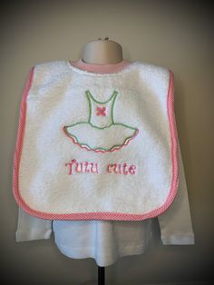 Made of thick, thirsty, & very absorbent terry cloth, this kind of bib is every parent's favorite. It pops right over child's head like a t-shirt - no snaps, velcro, or ties to get in the way. Machine embroidered design makes for long lasting color. Finished bib is approximately 19 x 12 inches. Neckline should fit 6 months to 3 years. Easy care machine wash and dry. Makes a great, unique shower or baby gift. PLEASE NOTE; COLOR OF BINDING MAY VARY FROM PICTURE. Cute Cotton Bib For Playtime, Playful Cotton Bib, Machine Washable, Playful Cotton Bib Machine Washable, Cute White Bib Front Bib, Pink Cotton Bib Machine Washable, Pink Cotton Machine Washable Bib, Playful White Cotton Bib, White Cotton Washable Bib, White Washable Cotton Bib