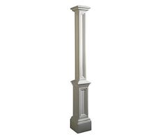 a tall white pole with a clock on it's top and two columns at the bottom