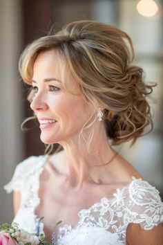 a woman in a wedding dress holding a bouquet