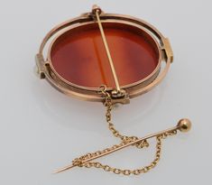 "This is a 18K Superb Bissinger Signed Yellow Gold Cameo Pendant Brooch - Carnelian Cameo Natural Pearl and native cut Cameo Pin tilted on back. \"Isabella 1760\" carved into the back and \"Brown + Rogers\" carved also, 8 old mine diamonds, 4 pearls to open frame, dated 1876 with safety stick pin, measures 32 x 40 mm, weight 30.6 grams, signed on front left. Bissinger is seldom offered for sale. Stock # BB76CRL25" Gift Yellow Gold Cameo Brooch, Heirloom Yellow Gold Cameo Brooches, Elegant Cameo Brooch In Yellow Gold, Luxury Yellow Gold Cameo Brooch, Gold Coin Jewelry, Gold Oval Cameo Brooch, Pendant Brooch, Claddagh Rings, Open Frame