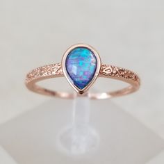 This Is A 7mmx5mm Teardrop Simulated Blue Opal Cabochon Set On Sterling Silver With 18k Rose Gold Over It. The Colors Inside Are Gorgeous And The Extra Detail On The Metal Work Gives It A More Upscale Look. Very Delicate And Elegant, See Pictures For Details. Pave Wedding Rings, Pandora Rose Gold, Blue Sapphire Diamond Ring, Blue Opal Ring, Sparkly Ring, Blue Sapphire Diamond, Red Diamond, Sapphire Diamond Ring, Ring Color