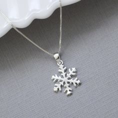 Sterling silver snowflake pendant on fine sterling silver necklace chain, bridesmaid gift OTHER SNOWFLAKE JEWELRY IN THE STORE: https://www.etsy.com/shop/alexandreasjewels/search?search_query=snowflake Snowflake size: 14mm Also available at 18mm in listing below: https://www.etsy.com/listing/205447671/snowflake-necklace-sterling-silver ADD-ON CHARMS: https://www.etsy.com/listing/205430600/add-a-charm-personalize-your-jewelry?ref=listing-shop-header-0 COMES CAREFULLY AND BEAUTIFULLY GIFT PACKAGED Silver Snowflake Necklace For Anniversary, Sterling Silver Snowflake Jewelry For Anniversary, Sterling Silver Snowflake Jewelry For Winter, Sterling Silver Necklaces For Winter Gifts, Sterling Silver Jewelry For Winter Gifts, Silver Jewelry As Winter Gift, Silver Jewelry For Winter Gift, Elegant Winter Jewelry As Gift, Silver Snowflake Necklace For Gift