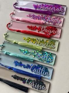 six personalized headbands with different colors and designs are on a white surface