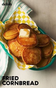 fried cornbreads in a bowl with butter on top and the words fried cornbread below