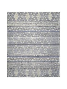 a gray and white rug with diamond shapes