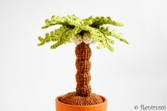 a small crocheted palm tree in a pot