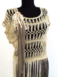 "Hand-woven macramé style tunic, tunic with fringe, Sheath with fringe, Tunic in modern Hippie style,Shabby chic recycled blouse in white. Tunic hand-knitted from white cotton cord and extended with recycled knitted fringes in white and beige. Soft and comfortable to wear. It will give you the freedom to move, as the idea of Hippie fashion - the fashion of the 70s of \"children with flowers\". It is a revived fashion statement of hippie fashion.   You will attract attention with this unique item Bohemian Tops With Tassel Ties And Short Sleeves, Bohemian Crochet Top With Tassels, Spring Cotton Crochet Top With Fringe, Beige Fringed Tops For Festival, Beige Fringe Tops For Festival, Bohemian Crochet Top With Short Sleeves, Summer Cotton Crochet Top With Fringe, Spring Bohemian Crochet Top With Macrame, Spring Bohemian Tops With Beaded Fringe