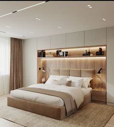 a bedroom with a large bed and built in shelves on the wall next to it