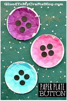 three paper plates with buttons on them sitting on a green surface and stars in the background