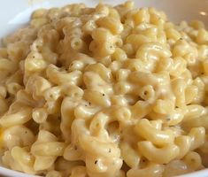 a white bowl filled with macaroni and cheese