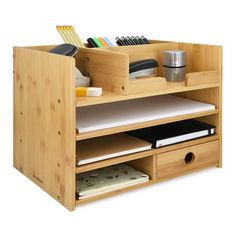 a wooden desk with drawers and books on it's sides, in front of a white background