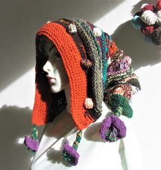 a mannequin head wearing a crocheted hat