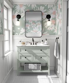 a bathroom with floral wallpaper and two sinks under a large mirror above the sink