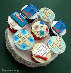 cupcakes decorated to look like they are made out of lego blocks and letters