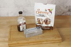 the ingredients to make an iced donut recipe on a cutting board with a bag of sugar