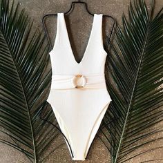 Chic Ribbed Swimwear For The Beach, White V-neck Bodysuit For Swimming, Chic Ribbed Bodysuit For The Beach, White Ribbed Swimwear For Summer, Solid Ribbed Bodysuit For Beach, Solid Ribbed Bodysuit For The Beach, Ribbed Beachwear Bodysuit For Vacation, Ribbed Bodysuit For The Beach, Summer Fitted Ribbed Bodysuit