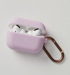 an airpods case with two white heads in it