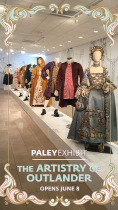 an exhibit with mannequins and dresses on display