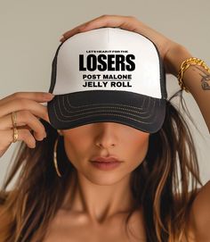 Post Malone ft Jelly Roll in LOSERS F 1 Trillion Trucker Hat. A 100% polyester front and 100% nylon mesh weave back make these hats super durable through regular wear and tear. They come in one size with an adjustable plastic snap closure: 22.8" (58cm). The cap's front has six rows of visor stitching. Pick any (or all) of the four-color variations and start customizing them with your original designs. .: Material: 100% polyester foam front with 100% nylon mesh weave back .: One size fits most (22.8"/58cm) .: Four color combinations to pick from .: Adjustable plastic snap closure .: Six row stitching on visor .: NB! Creases on the hat will straighten out naturally once unpackaged and worn Black Baseball Hat, Hat Summer, Summer Concert, Post Malone, Jelly Roll, Baseball Hat, F 1, Trucker Cap, Snap Closure