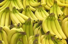 many bunches of bananas are stacked together