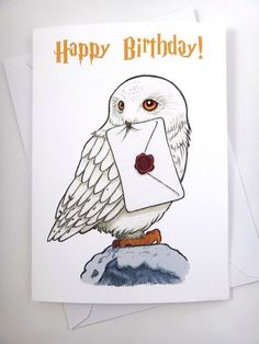 an owl is holding a letter in its hand and the words happy birthday are written on it