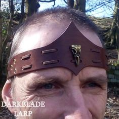 A leather headband with a metal bird skull in a bronze colour mounted on it. The leather headband is made of three sections riveted together, while the bird skull is held in place with microfibre suede lacing. The the headband is held in place by lace at the back running through holes with metal eyelets making it size adjustable from 21" upward.  Wrinkly head dummy not included. Griffin Armor, Viking Outfit, Leather Headband, Bronze Colour, Ren Fest, Headband Outfit, Leather Ideas, Leather Headbands, Etsy Stuff