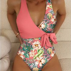 Pretty, Tie Front, Tropical Printand Coral Color Bathing Suit. Get Ready For The Warmer Weather And Beach By Adding This To Your Summer Wardrobe. Material: 85% Polyester And 15% Elastane. High Stretch. Available In Blue And Tropical Pattern As Well.