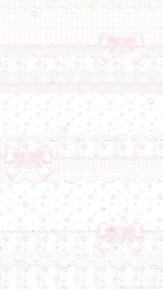 a white and pink wallpaper with bows on it