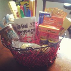 a basket filled with coffee and snacks on top of a table