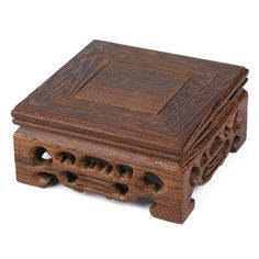 a wooden box with holes in the middle