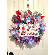 a christmas wreath is hanging on the front door