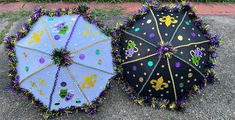 two decorated umbrellas sitting next to each other