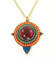 Add a pop of color with this boho, multicolor necklace. It features a bright, colorful pendant with a red stone in the center, tiny orange and green beads and three turquoise rhinestone accents. Pendant is 1 7/16 inches long. Necklace chain - 16, 18, 20, 22, 24, 26, 28 or 30 inches long. See all photos for size reference. Stones are acrylic and glass. All metal is gold plated. ---------------------------------- I designed this necklace and will make one just for you. It will ship in a cotton fil Bohemian Red Jewelry With Gemstone Accents, Red Bohemian Necklace With Large Pendant, Red Amulet Style Round Pendant Jewelry, Red Bohemian Round Pendant Jewelry, Red Amulet Pendant, Red Medallion Necklace With Large Pendant, Orange Bohemian Jewelry With Round Pendant, Red Large Pendant Jewelry For Festival, Red Jewelry With Large Pendant For Festivals