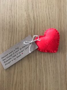 a red heart with a tag attached to it