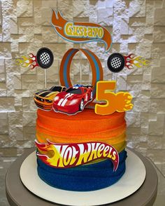 a birthday cake with hot wheels on it