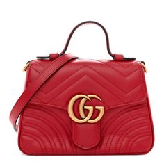 This is an authentic GUCCI Calfskin Matelasse Mini GG Marmont Top Handle Shoulder Bag in Hibiscus Red.This shoulder bagis crafted of smooth calfskin leather in red. The bag features a red leather top handle, an optional aged gold chainshoulder strap with leather shoulder pad, and gold GG logo on the crossover flap. This opens to a beige microfiber interior with a patch pocket. Classic Gucci Soft Leather Bag, Gucci Soft Leather Top Handle Shoulder Bag, Designer Gucci Bag In Soft Leather, Designer Gucci Soft Leather Bag, Gucci Soft Leather Crossbody Bag, Luxury Gucci Soft Leather Bag, Red Gucci Shoulder Bag With Detachable Handle, Gucci Red Shoulder Bag With Gold-tone Hardware, Red Gucci Shoulder Bag With Gold-tone Hardware