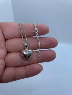 "Sterling Silver, hammered style, smooth puffy heart shape pendant. Approximate heart size: 15mm Diameter x 9mm Thickness. Chain: 1mm box chain (16\"/18\"/20\") 🌟 All our Silver Jewelry are handmade or handcrafted and guaranteed 925 silver.  ⭐️Free silver polishing cloth  ⭐�️ It's completely natural for sterling silver to oxidize over time when it's exposed to air. Please, keep them in airtight plastic bag and use sterling silver polishing cloth to make them shine like new again. ⭐️ Each piece i Puffy Heart, Heart Shape Pendant, Hammered Silver, Box Chain, Minimalist Jewelry, Heart Shape, Heart Necklace, Plastic Bag, Heart Pendant